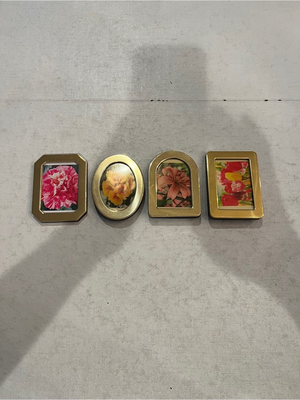 Set of 4 mini Gold Tone Photo Frames. All different shapes. So cute!